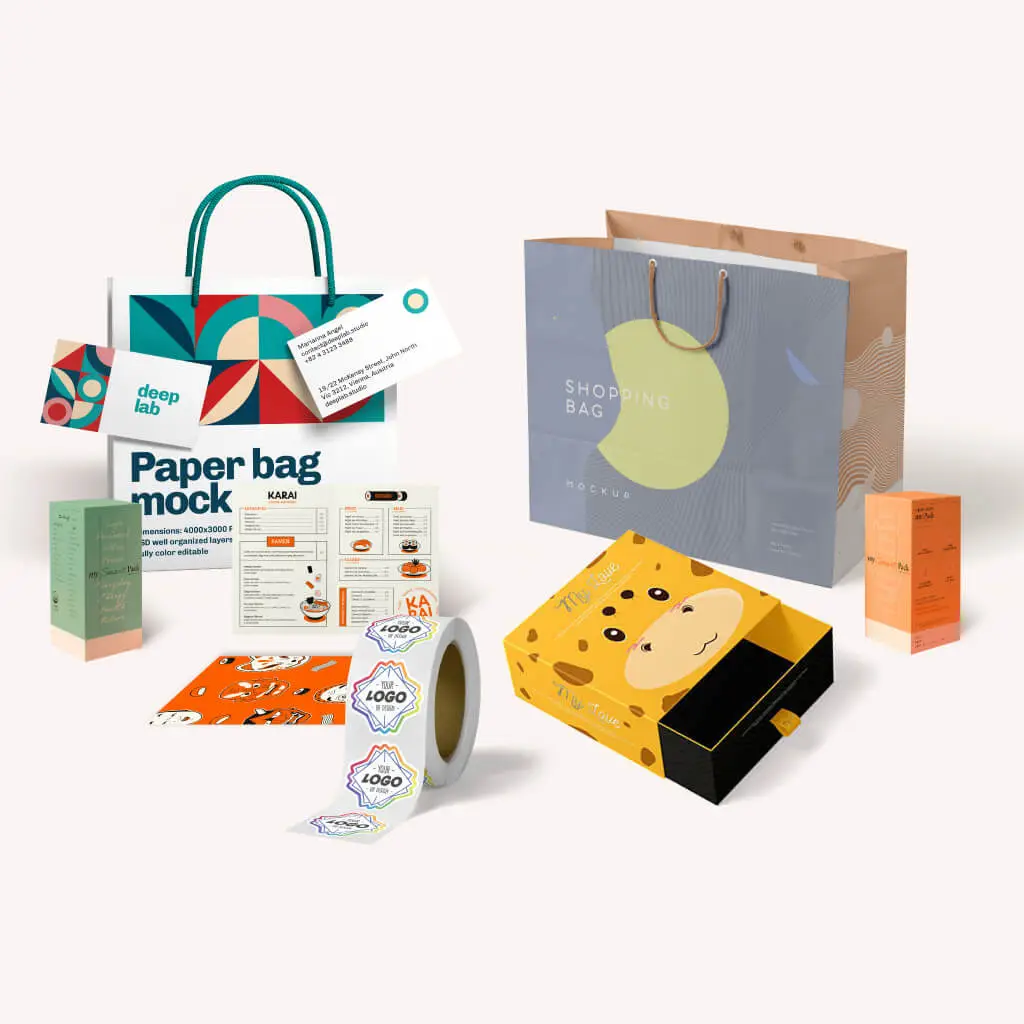 Flat-lay display of clothing packaging products including a custom zipper bag, luxury paper bag, rigid box, and kraft hang tag with woven label