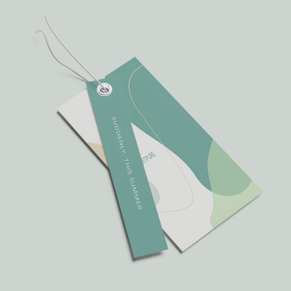 Stylish hang tag with string attached to garment, showing custom clothing branding