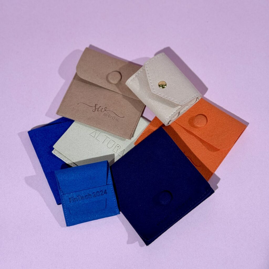 Assorted custom fabric jewelry pouches for personalized and elegant packaging solutions.