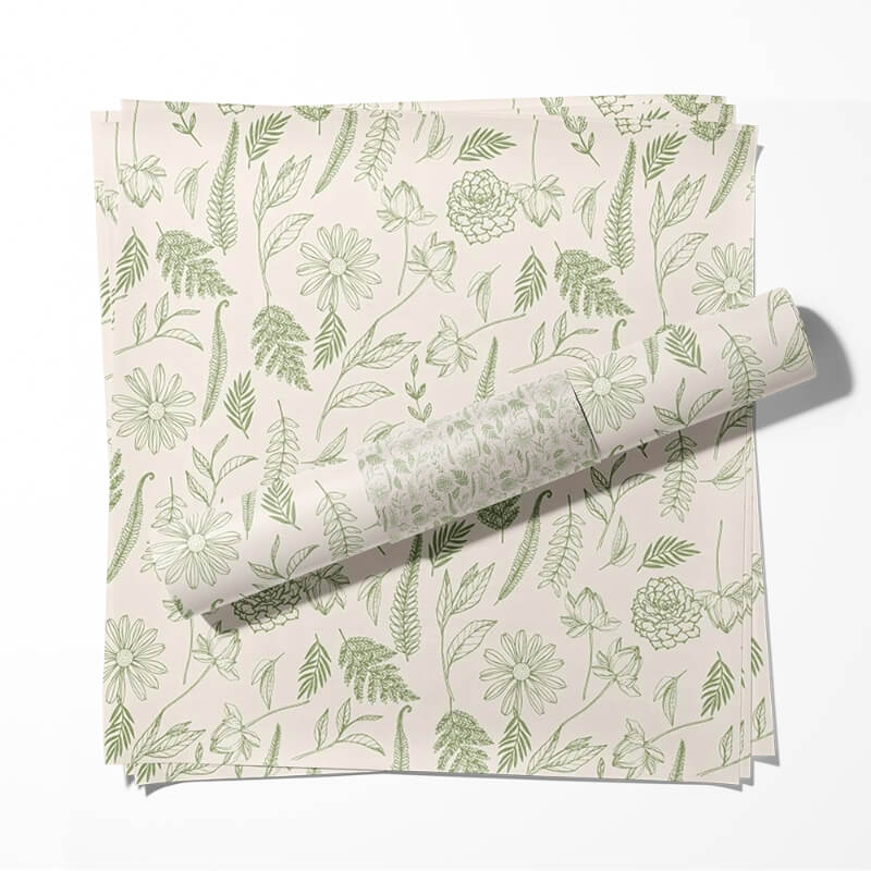 Printed tissue paper wrapping a folded garment inside a box, enhancing unboxing experience