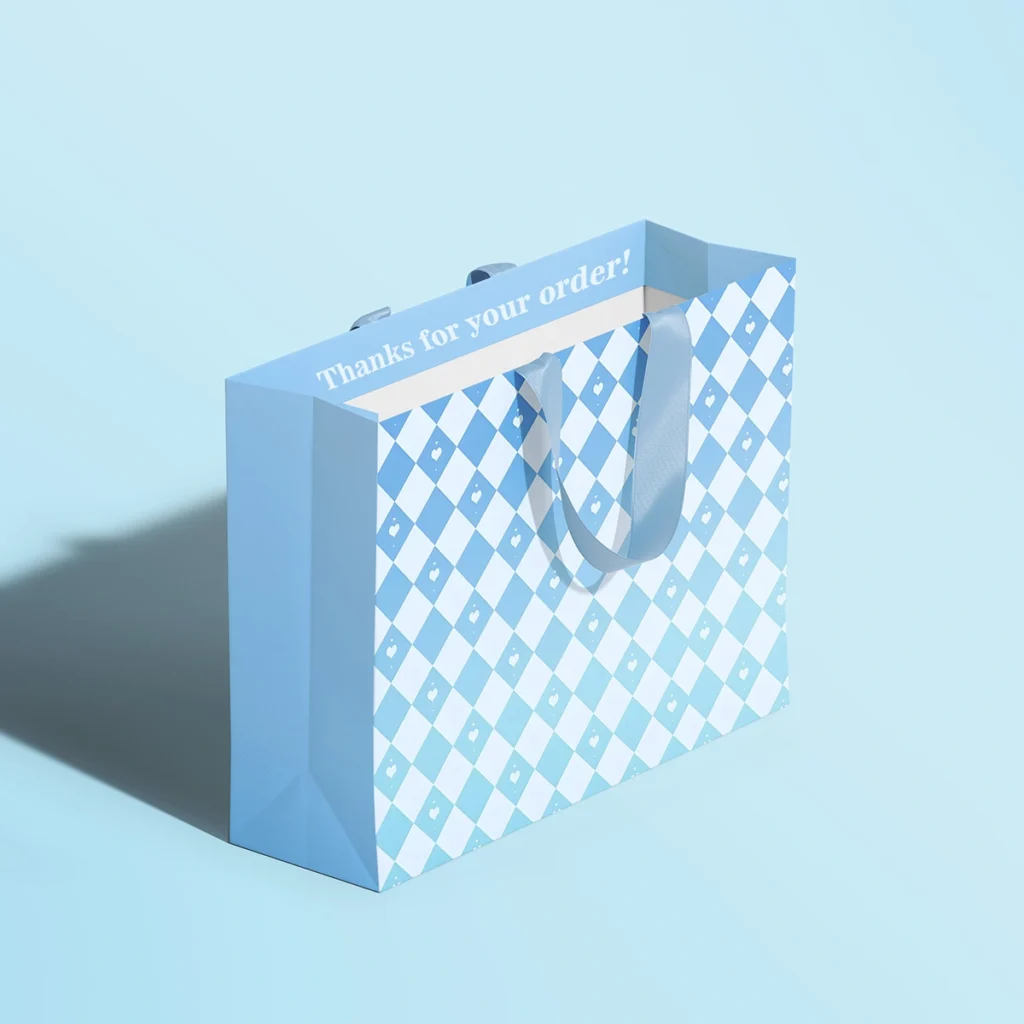 Custom thank you paper bags with blue checkered design and ribbon handles, wholesale shopping packaging