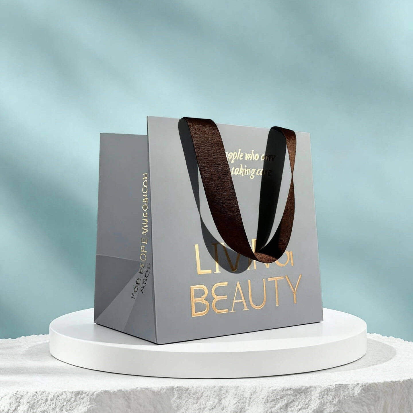 Luxury retail paper bag with gold foil details and ribbon handles