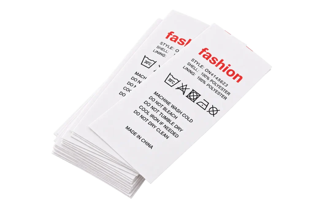 Custom care labels for clothing with wash instructions, fabric content and care symbols for apparel brands